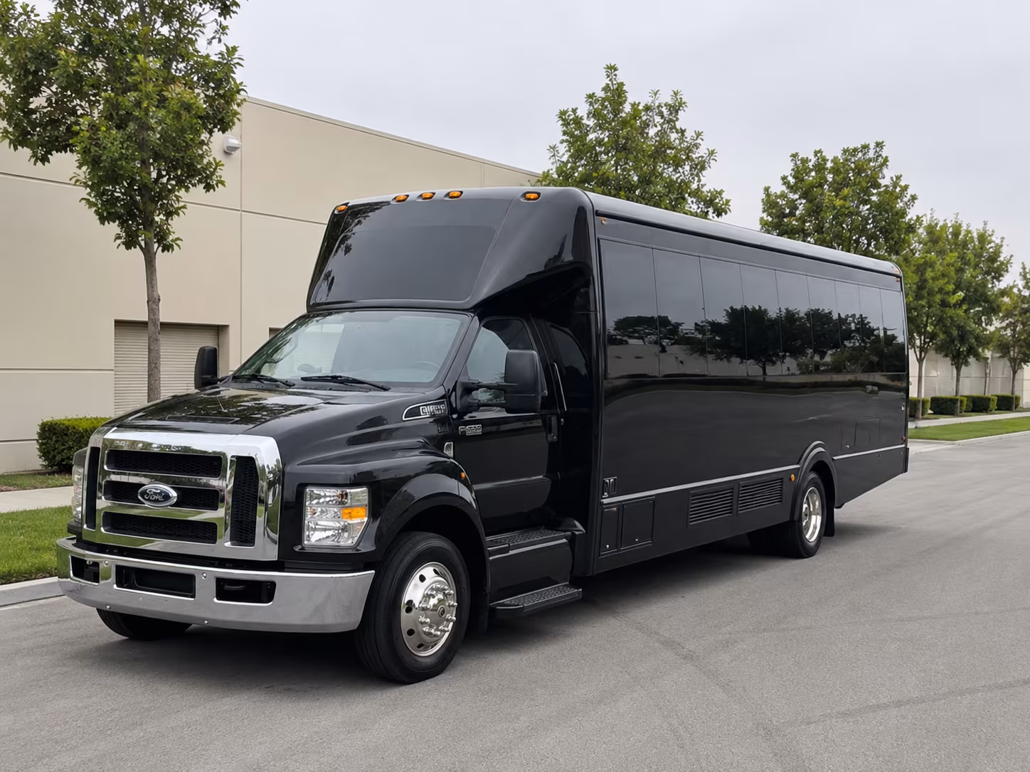Group beside a Mercedes Sprinter limo in Louisville